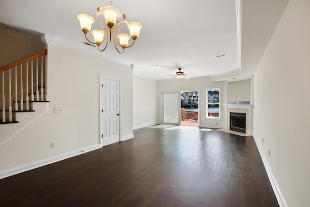unfurnished living room with stairway, baseboards, wood finished floors, and ceiling fan with notable chandelier
