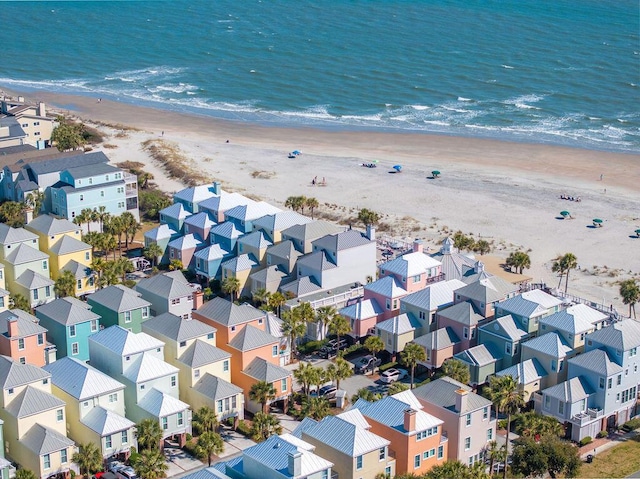 aerial view with a residential view, a water view, and a view of the beach