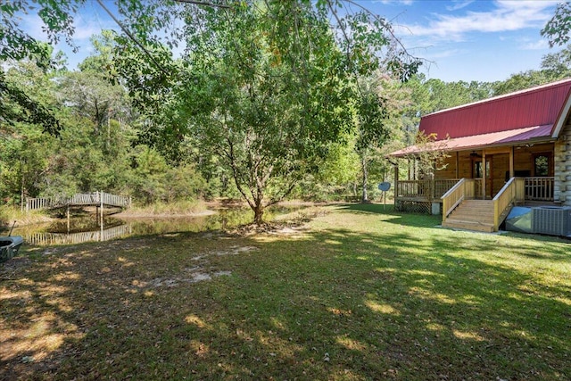 view of yard with covered porch