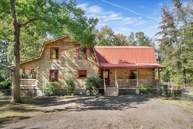 cabin featuring covered porch