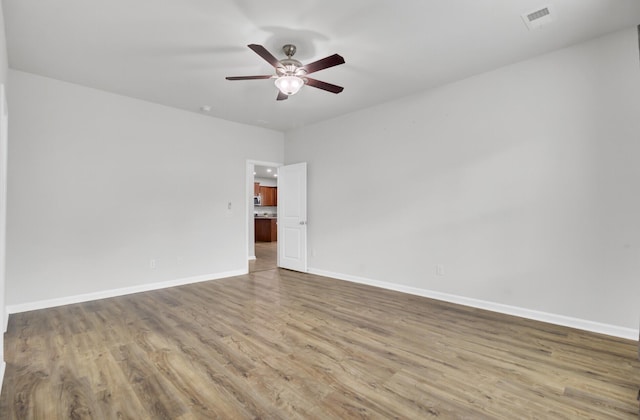 121 Ancestry Ln, Moncks Corner, SC 29461 - spare room featuring wood finished floors, a ceiling fan, and baseboards