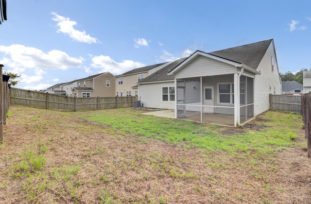 121 Ancestry Ln, Moncks Corner, SC 29461 - rear view of house featuring a patio area, a sunroom, central AC unit, and roof with shingles