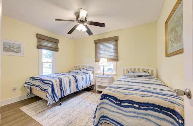 bedroom featuring hardwood / wood-style flooring and ceiling fan