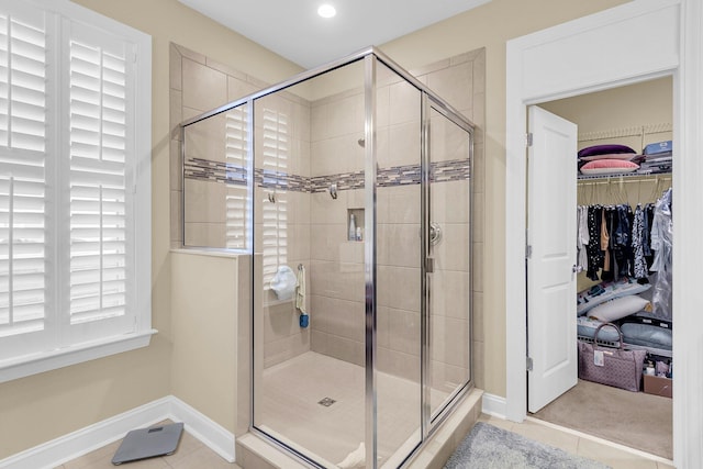 bathroom featuring tile patterned floors and an enclosed shower