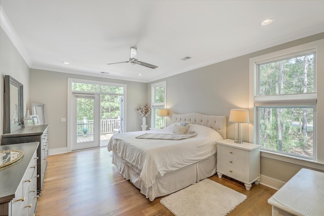 bedroom featuring ceiling fan, light wood-type flooring, ornamental molding, and access to exterior