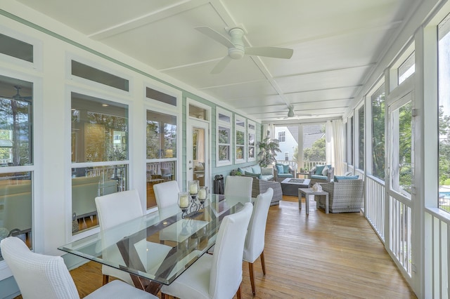 sunroom / solarium featuring ceiling fan