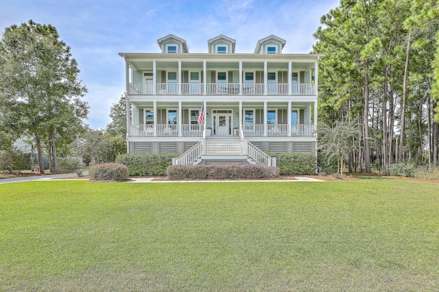 view of front facade with a porch and a front lawn