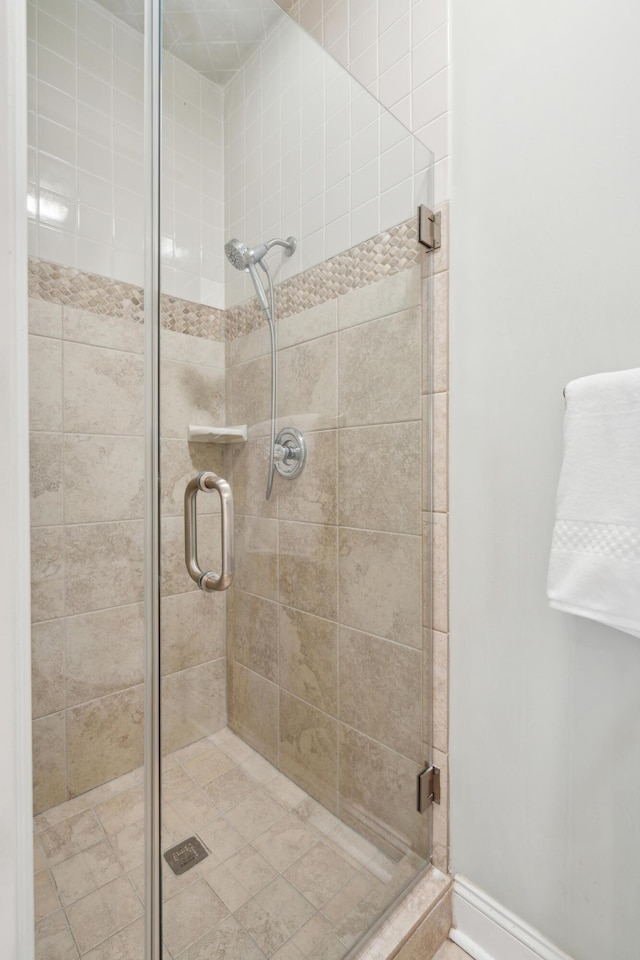 bathroom with a shower stall