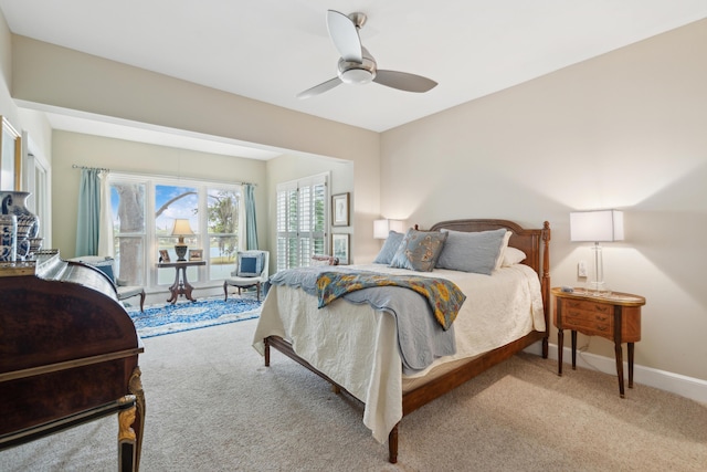 bedroom featuring carpet floors, a ceiling fan, and baseboards
