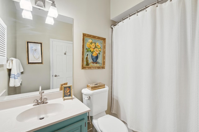 full bathroom with vanity and toilet
