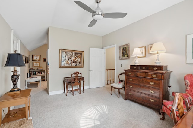 sitting room featuring baseboards, ceiling fan, and light carpet