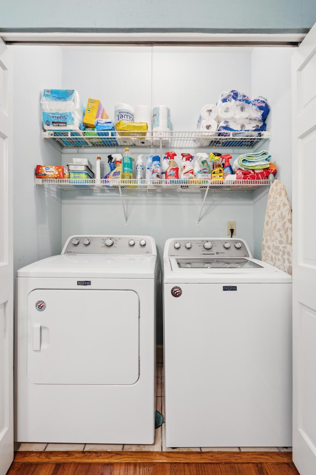washroom featuring laundry area and washer and clothes dryer