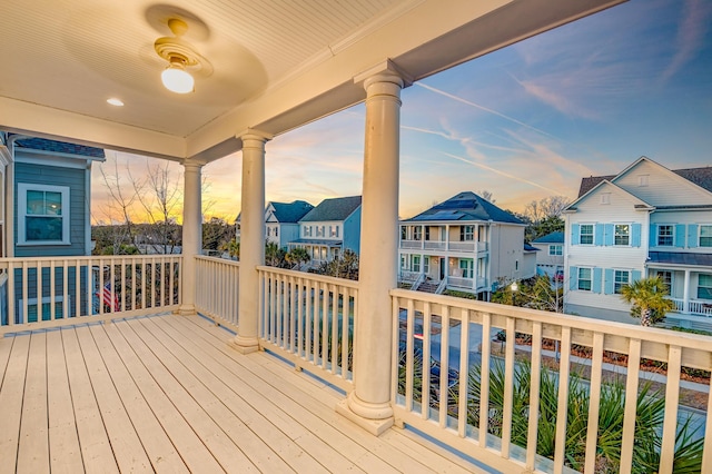 deck at dusk with a residential view