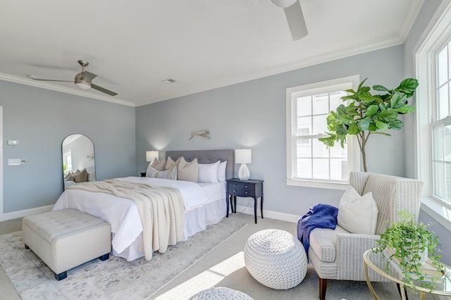 bedroom featuring baseboards, a ceiling fan, and crown molding