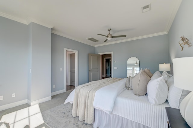 bedroom with light colored carpet, crown molding, baseboards, and visible vents