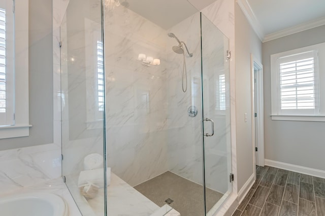 bathroom featuring baseboards, a marble finish shower, wood tiled floor, a sink, and ornamental molding