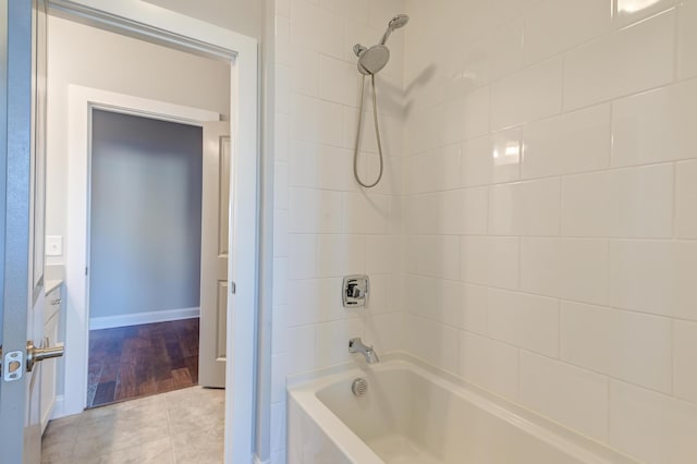 full bath with tile patterned floors and shower / bathtub combination