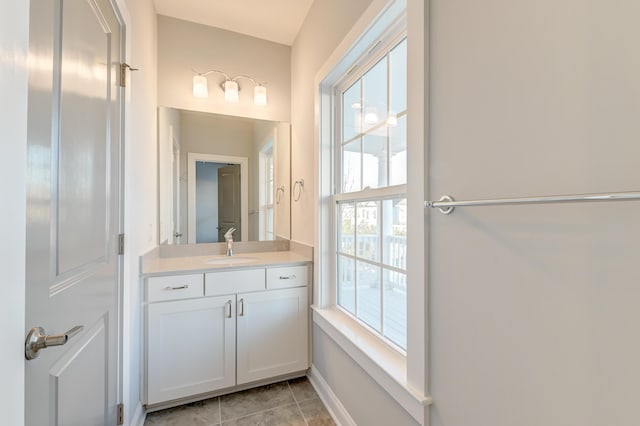 bathroom with tile patterned floors and vanity