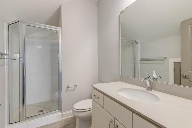 full bath featuring toilet, a stall shower, and vanity