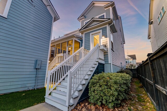 exterior entry at dusk with fence