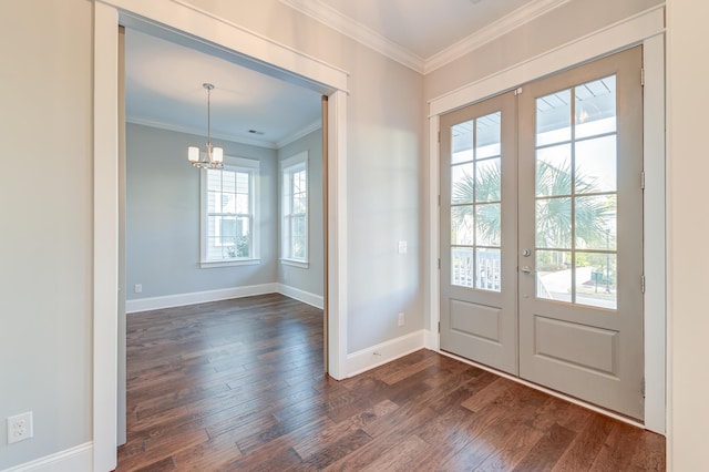 foyer with french doors, dark wood-type flooring, and ornamental molding