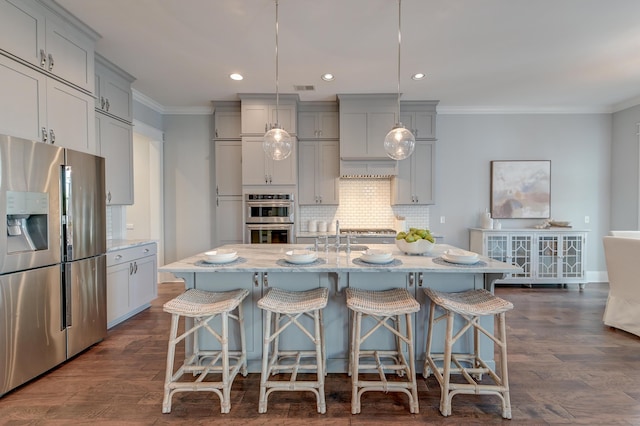 kitchen with tasteful backsplash, dark wood finished floors, ornamental molding, gray cabinets, and stainless steel appliances