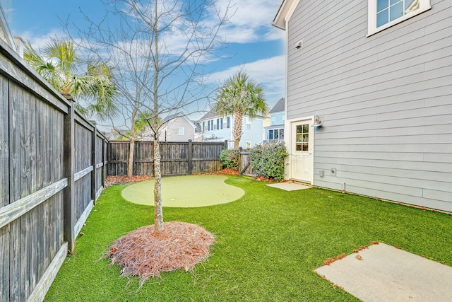 view of yard with a fenced backyard