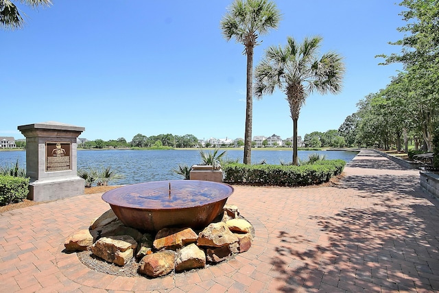 view of patio featuring a water view