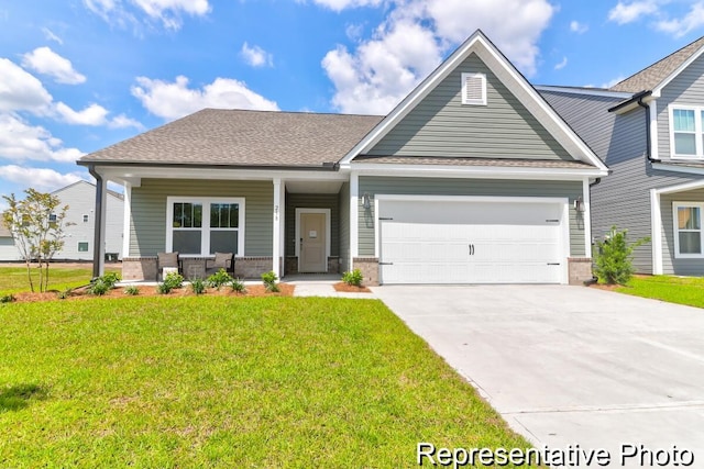 craftsman-style house with a front yard, a porch, concrete driveway, a garage, and brick siding