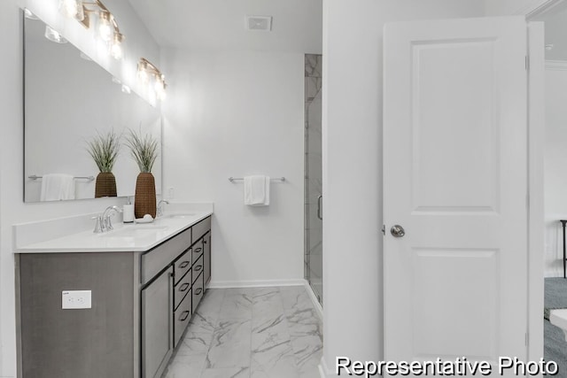 bathroom featuring visible vents, double vanity, a stall shower, marble finish floor, and a sink