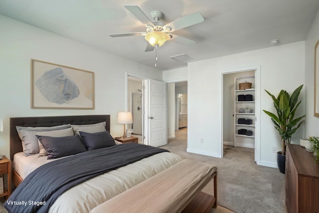 211 Saxony Loop, Summerville, SC 29486 - bedroom with light colored carpet, baseboards, a walk in closet, and a ceiling fan