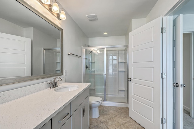211 Saxony Loop, Summerville, SC 29486 - bathroom featuring a shower stall, toilet, vanity, and tile patterned floors