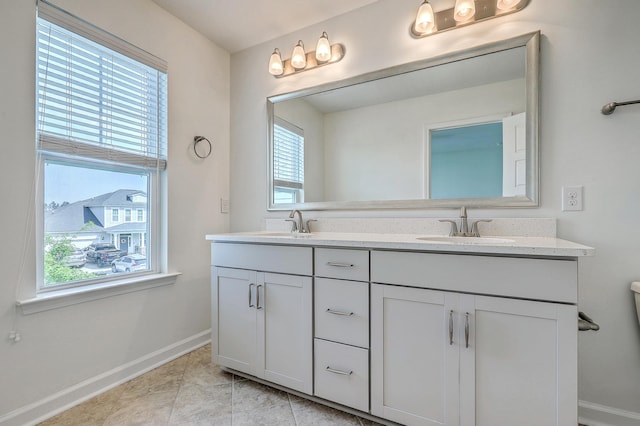 211 Saxony Loop, Summerville, SC 29486 - bathroom with baseboards, double vanity, and tile patterned flooring