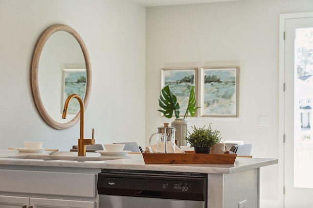 bar featuring dishwasher and sink