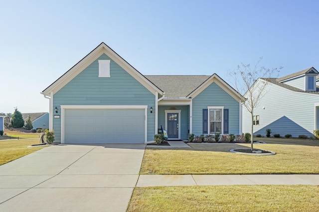 view of front of house with a garage, concrete driveway, and a front yard