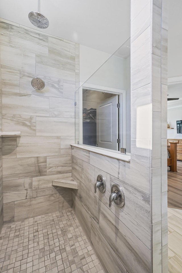 full bath featuring tiled shower