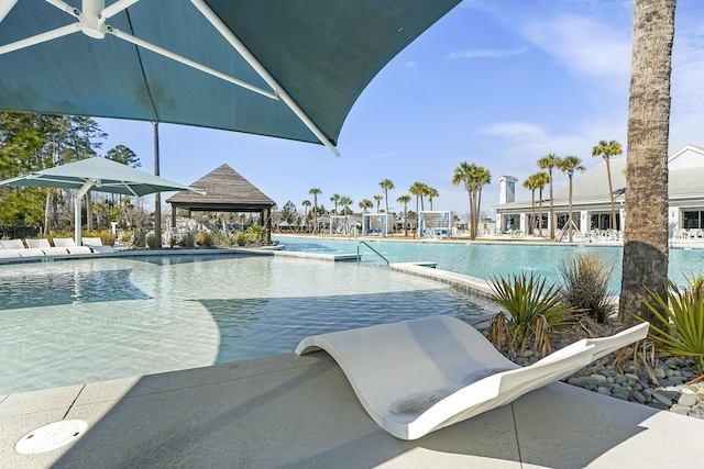 pool with a patio area and a gazebo