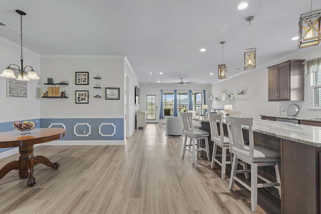 dining room featuring recessed lighting, light wood-style floors, ornamental molding, ceiling fan, and baseboards