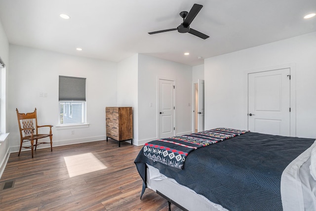 bedroom with dark wood-type flooring and ceiling fan