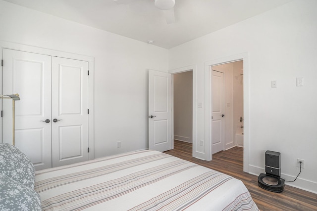 bedroom featuring dark wood-type flooring, ceiling fan, and a closet