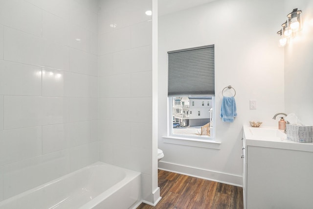 full bathroom featuring vanity, wood-type flooring, bathing tub / shower combination, and toilet