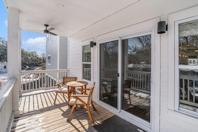 wooden terrace with ceiling fan