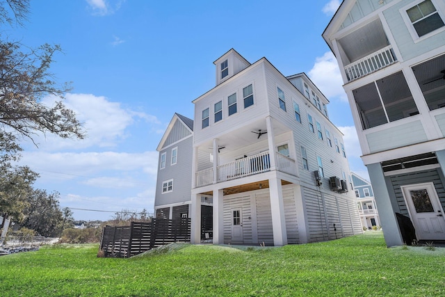 rear view of property with a lawn