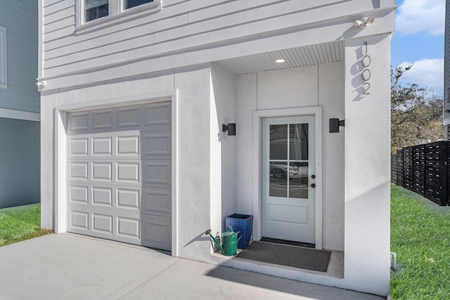 property entrance with a garage