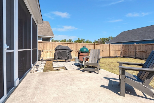 view of patio / terrace featuring a fenced backyard and grilling area