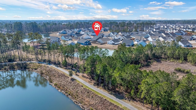 drone / aerial view with a residential view and a water view