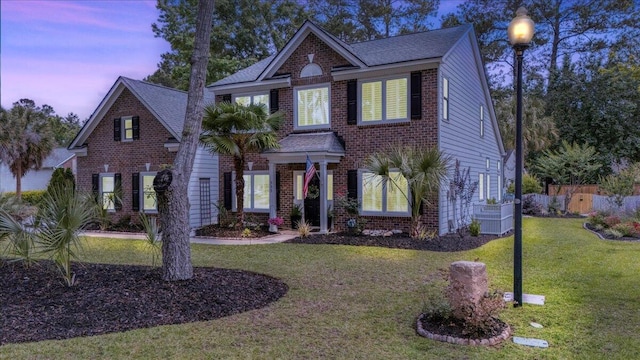 555 Pointe Of Oaks Rd, Summerville, SC 29485 - colonial home with brick siding and roof with shingles