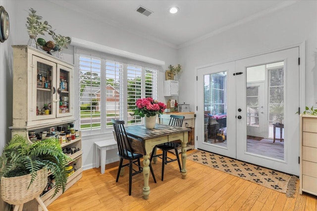555 Pointe Of Oaks Rd, Summerville, SC 29485 - dining area with french doors, crown molding, light wood finished floors, and recessed lighting