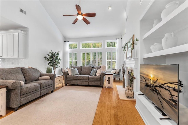 555 Pointe Of Oaks Rd, Summerville, SC 29485 - living area with ceiling fan, light wood finished floors, and high vaulted ceiling