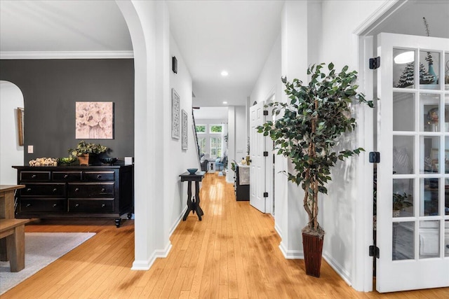 555 Pointe Of Oaks Rd, Summerville, SC 29485 - hallway with arched walkways, light wood-style flooring, baseboards, recessed lighting, and crown molding